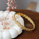 Bracelet Marguerite en acier inoxydable plaqué or, bijou floral artisanal élégant - Flowrette