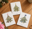 trio de cartes postales sapin de noël bleu, rose et jaune