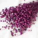 Botte de lin violet séché dans un vase Flowrette